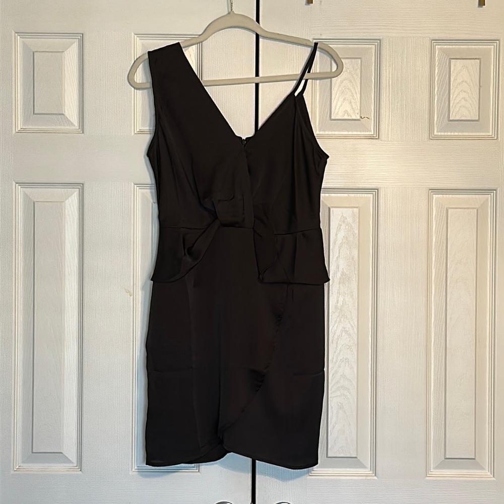 Asymmetrical black mini dress. Wrap around style. Size M.